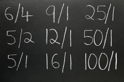 Betting odds written on a blackboard.